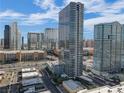 Aerial view of modern highrise building and city at 4471 Dean Martin Dr # 2000, Las Vegas, NV 89103