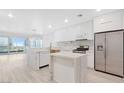 Modern kitchen with white cabinetry, quartz countertops, and stainless steel appliances at 4575 Dean Martin Dr # 2211, Las Vegas, NV 89103