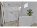 Bright and airy entryway with hardwood floors and staircase at 3227 Monaco Shores Dr, Las Vegas, NV 89117