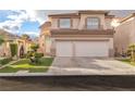 Two-story house with a two-car garage and a manicured lawn at 3227 Monaco Shores Dr, Las Vegas, NV 89117