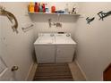 Condo laundry room with washer, dryer, and shelving at 3550 Bay Sands Dr # 2089, Laughlin, NV 89029