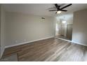 Bright living room with wood-look floors and access to the hallway at 3875 Redwood St, Las Vegas, NV 89103