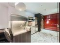 Modern kitchen with stainless steel appliances and sleek cabinetry at 4381 W Flamingo Rd # 5220, Las Vegas, NV 89103