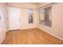 Empty dining area with hardwood floors and window coverings at 860 Bobcat Run, Mesquite, NV 89034