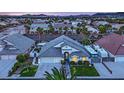 Elevated view of single-story house, two-car garage, and spacious yard at 233 Molly Ct, Las Vegas, NV 89183