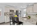 Modern kitchen with granite countertops and stainless steel appliances at 3620 E Chablis, Pahrump, NV 89048