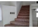 Carpeted upstairs hallway with access to bedrooms at 8332 Shore Breeze Dr, Las Vegas, NV 89128