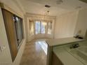 Cozy dining area with a bay window and tile floor at 10013 Cresent Creek Dr, Las Vegas, NV 89134