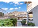 View of parking area with mountain backdrop at 3570 Cactus Shadow St # 101, Las Vegas, NV 89129