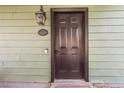 Dark brown front door with a welcoming entryway at 509 Kings Ave, North Las Vegas, NV 89030