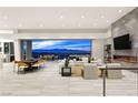 Open floor plan living area with panoramic city views at 661 Ridgestone Rim Ct, Henderson, NV 89012