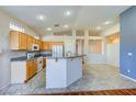 Kitchen features granite countertops and light wood cabinets at 2968 Panorama Ridge Dr, Henderson, NV 89052