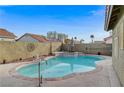 Inviting kidney shaped pool with spa and large patio area at 5320 Rebecca Rd, Las Vegas, NV 89130