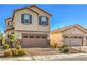 Two-story house with tan exterior, brick driveway, and gray shutters at 6138 Villa Lante Ave, Las Vegas, NV 89113