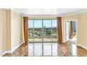 Living room with marble floors and sliding glass doors showcasing a scenic view at 322 Karen Ave # 903, Las Vegas, NV 89109