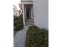 Inviting entryway with stairs leading to the front door at 5412 Harmony Green Dr # 201, Las Vegas, NV 89149