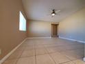 Spacious living room featuring tile floors and a ceiling fan at 6524 Ouida Way, Las Vegas, NV 89108