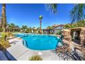 Inviting pool with a rock grotto and ample lounging space at 4813 W Richmar Ave, Las Vegas, NV 89139