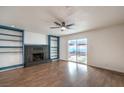 Bright living room featuring built-in shelves and fireplace at 3567 Markam St, Las Vegas, NV 89121