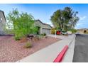 Landscaped front yard with desert landscaping and single story home at 1153 Pine Cove Ct, Henderson, NV 89011