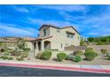 Two-story house with gray garage door and landscaped yard at 2 Vicolo Verdi, Henderson, NV 89011