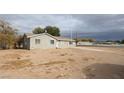 House exterior showcasing a front yard and desert landscaping at 2060 Bowman Rd, Logandale, NV 89021