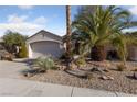 House exterior showcasing desert landscaping and a two-car garage at 502 Edgefield Ridge Pl, Henderson, NV 89012