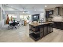 Spacious kitchen with island, stainless steel appliances, and granite countertops at 9843 High Alpine St, Las Vegas, NV 89178