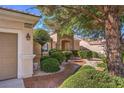 Front exterior of the home, highlighting the garage, entryway, and address at 2409 Anderson Park Dr, Henderson, NV 89044