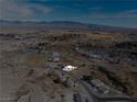 Aerial view of single story home on a large lot with mountain views at 1261 S Comstock St, Pahrump, NV 89048