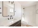 Updated bathroom with a white vanity, modern fixtures, and a large walk-in shower at 4260 Twilight St, Las Vegas, NV 89122