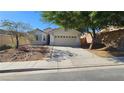 One-story home with a landscaped yard and attached garage at 6033 Sierra Medina Ave, Las Vegas, NV 89139