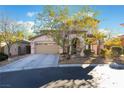 Two-story house with attached garage and mature tree at 8647 Isla Vista Valley Ct, Las Vegas, NV 89178