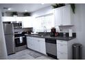 Modern kitchen with stainless steel appliances and white cabinets at 4622 Grand Dr # 1, Las Vegas, NV 89169