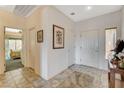 View of tiled entryway with access to bedroom and kitchen at 542 Eagle Perch Pl, Henderson, NV 89012