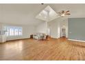 Bright living room featuring hardwood floors and vaulted ceilings at 7831 Rancho Destino Rd, Las Vegas, NV 89123