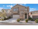 Two-story house with stone accents and landscaping at 7937 Eastern Elk St, Las Vegas, NV 89149