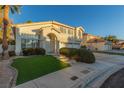 Two-story house with a three-car garage and manicured landscaping at 2673 Mallard Landing Ave, Henderson, NV 89074