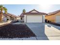 Single story home with a one car garage and rock landscaping at 582 Grimsby Ave, Henderson, NV 89014