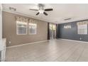 Spacious living room featuring tile floors and ceiling fan at 6972 Placid Lake Ave, Las Vegas, NV 89179