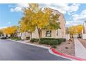 Two-story house with a walkway to the front door and yellow trees at 7587 French Springs St, Las Vegas, NV 89139