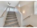 Carpeted staircase with metal railing leading to upper level at 6722 Sumatra St, Las Vegas, NV 89166