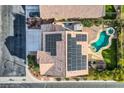 Home with solar panels, pool, and pergola, seen from above at 5819 Casa Madera Ct, Las Vegas, NV 89131