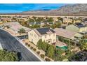 Two story house with solar panels, pool and mountain views at 5819 Casa Madera Ct, Las Vegas, NV 89131