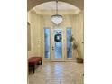 Elegant entryway with chandelier and tiled flooring at 7321 Gentle Valley St, Las Vegas, NV 89149