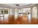 Open living room with hardwood floors and views into the kitchen at 8243 Twin Rock Ct, Las Vegas, NV 89113