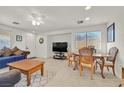 Casual dining area with table and chairs, adjacent to living room at 6058 Ambleshire Ave, Las Vegas, NV 89139