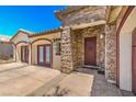 Elegant home exterior with stone accents and a charming entryway at 5396 Splendido Ave, Pahrump, NV 89061