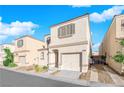 Two-story house with attached garage, driveway, and landscaping at 10068 Crisp Clover St, Las Vegas, NV 89183