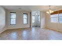 Bright dining room with tile floors and large windows at 10292 Kalang St, Las Vegas, NV 89178